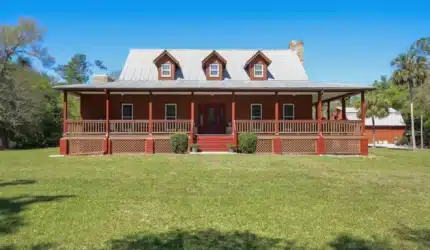 Front of 2-story house in Florida with wraparound porch