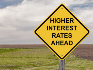 Road sign that says higher interest rates ahead