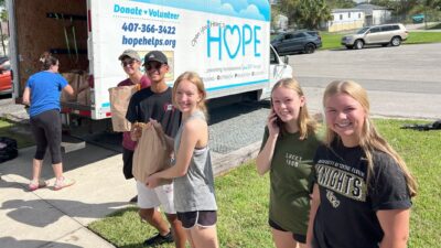 Hagerty High School Spanish Honor Society Students Unload the Truck of Donated Groceries